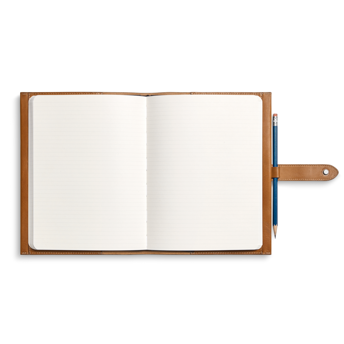 A Shinola Large Journal Cover in Tan, crafted from rich Italian Vachetta leather, holds an open lined notebook and a pencil looped on the right side, all viewed from above on a white background.