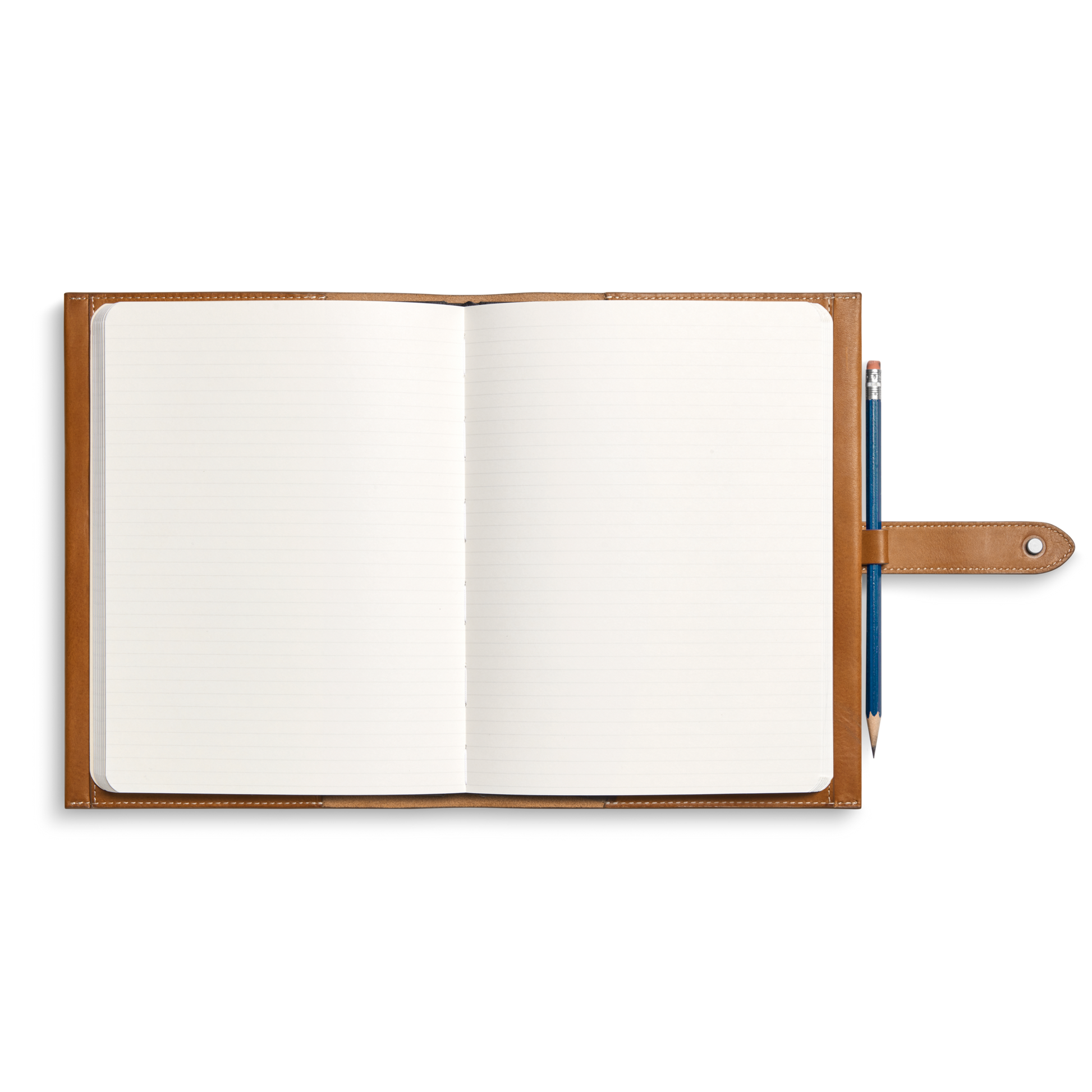 A Shinola Large Journal Cover in Tan, crafted from rich Italian Vachetta leather, holds an open lined notebook and a pencil looped on the right side, all viewed from above on a white background.