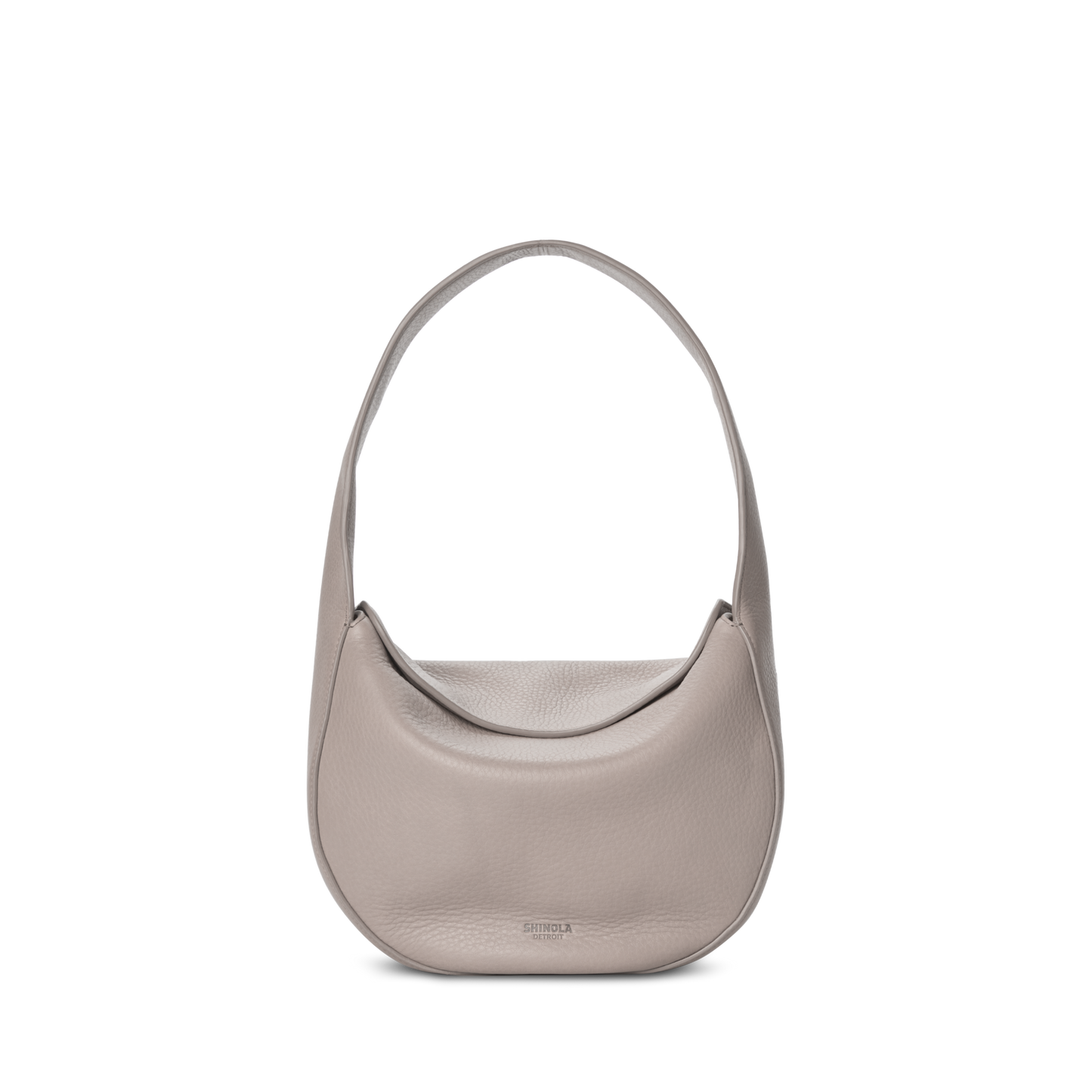 The Shinola Small Shoulder Bag - Taupe features a minimalist crescent-shaped design in premium leather with a wide strap, shown against a white background.