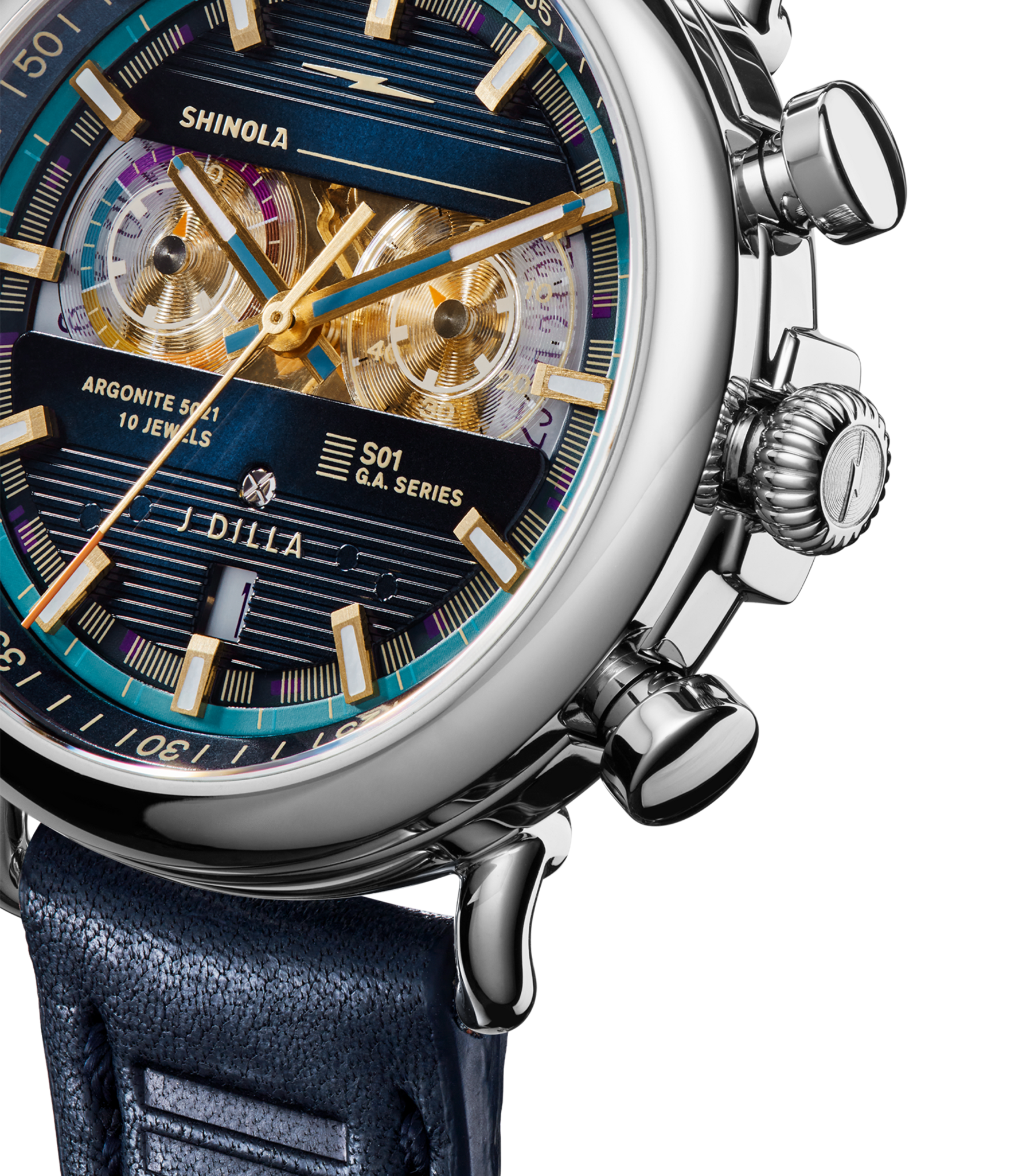 Close-up of the Shinola J Dilla Runwell Chronograph Watch - Midnight Blue, featuring blue and gold detailing, multiple dials, chrome buttons, visible gears through the face, and a blue leather strap.