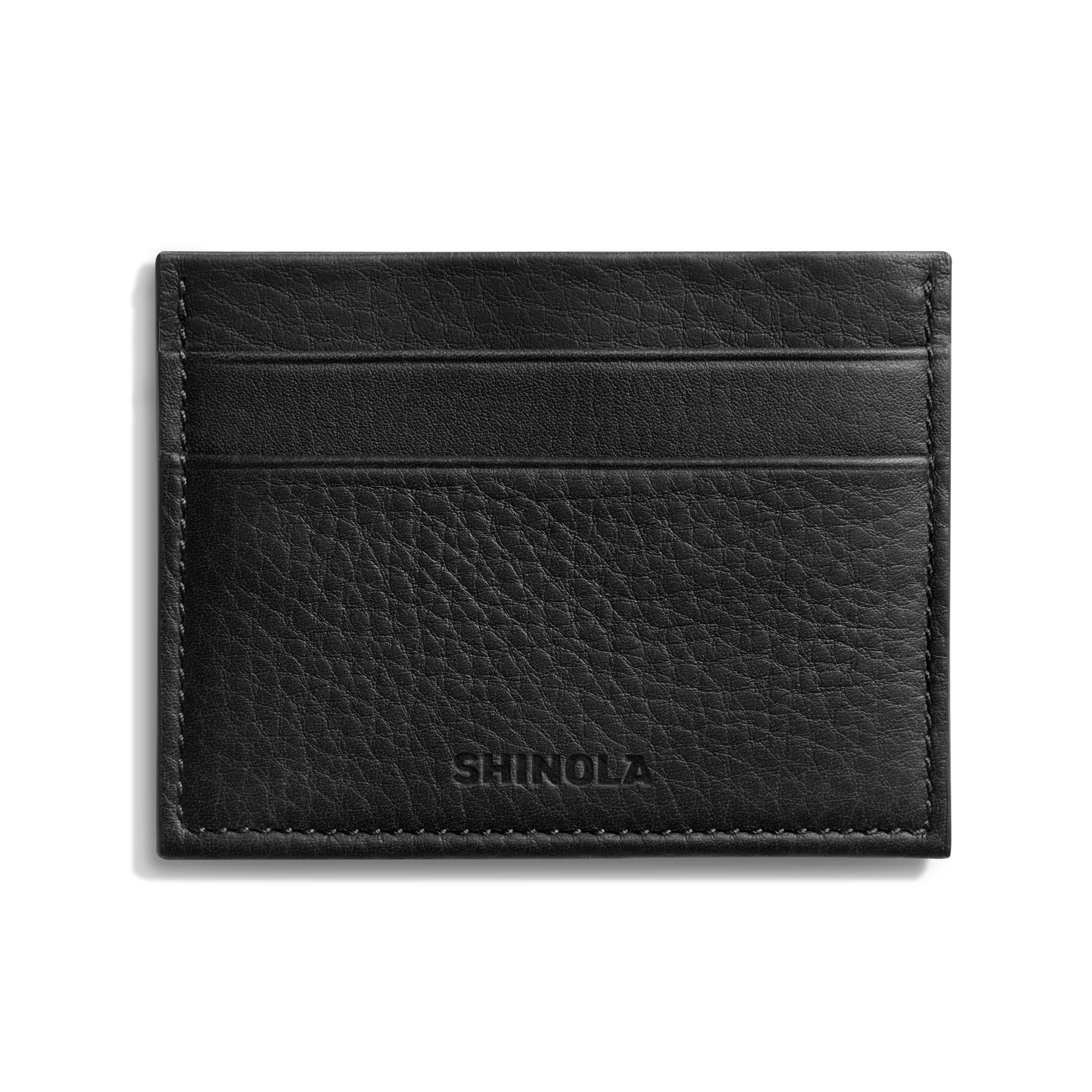 The Shinola 5 Pocket Card Holder in black leather features two horizontal card slots and SHINOLA embossed on the front, combining sleek style and convenience. Displayed against a white background.