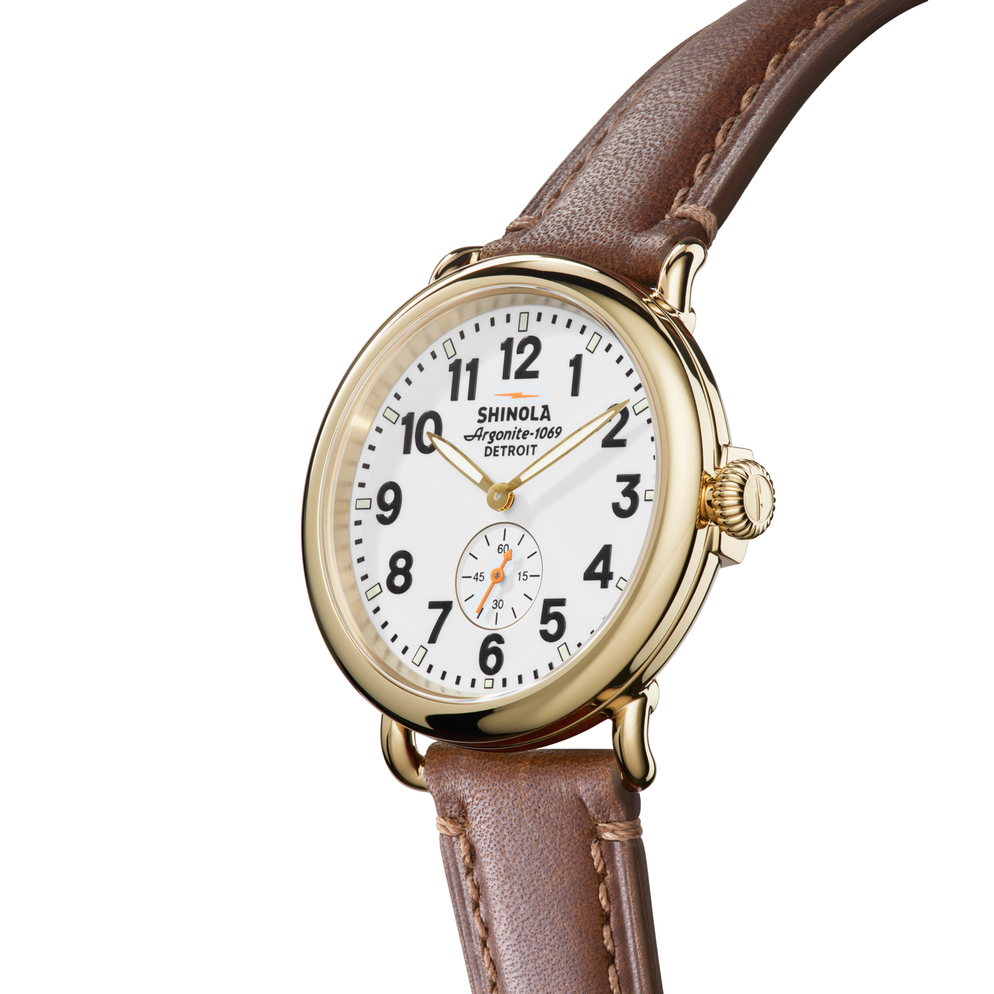 The Shinola Runwell Watch - White has a gold case, white face, black numerals, brown strap, and a small seconds subdial above 6 o’clock, shown on a plain white background.