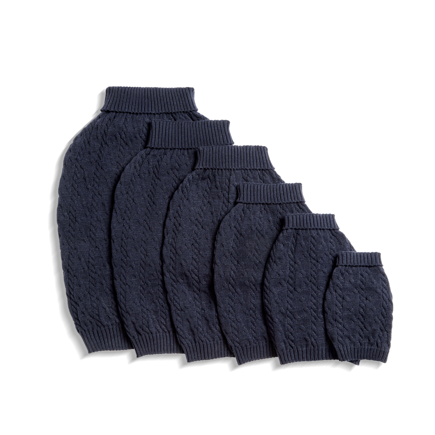 Five Shinola Cable Knit Dog Sweaters in navy are arranged from largest to smallest in a row on a white background.