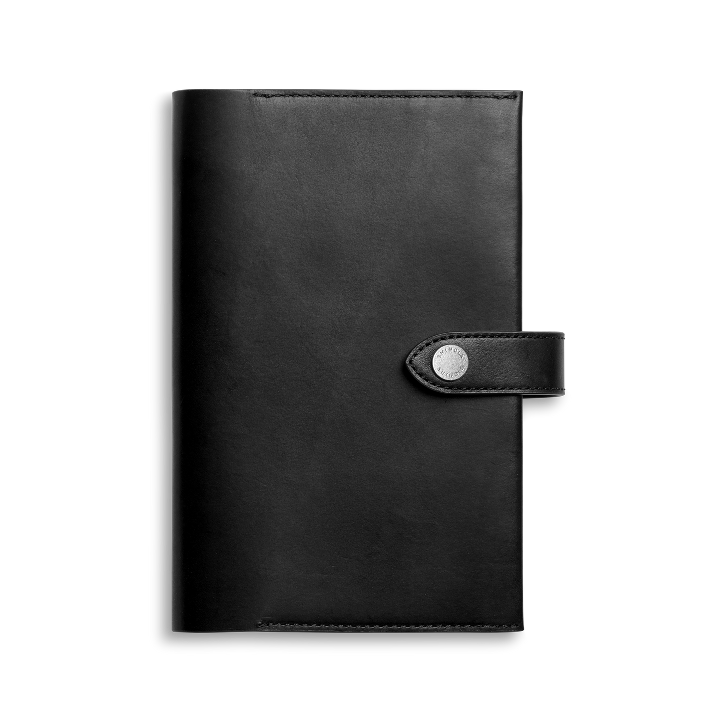 The Shinola Medium Snap Journal Cover in black Vachetta features visible edge stitching and a sleek, sophisticated design, with a flap closure secured by a snap button for a polished and luxurious Italian leather look.