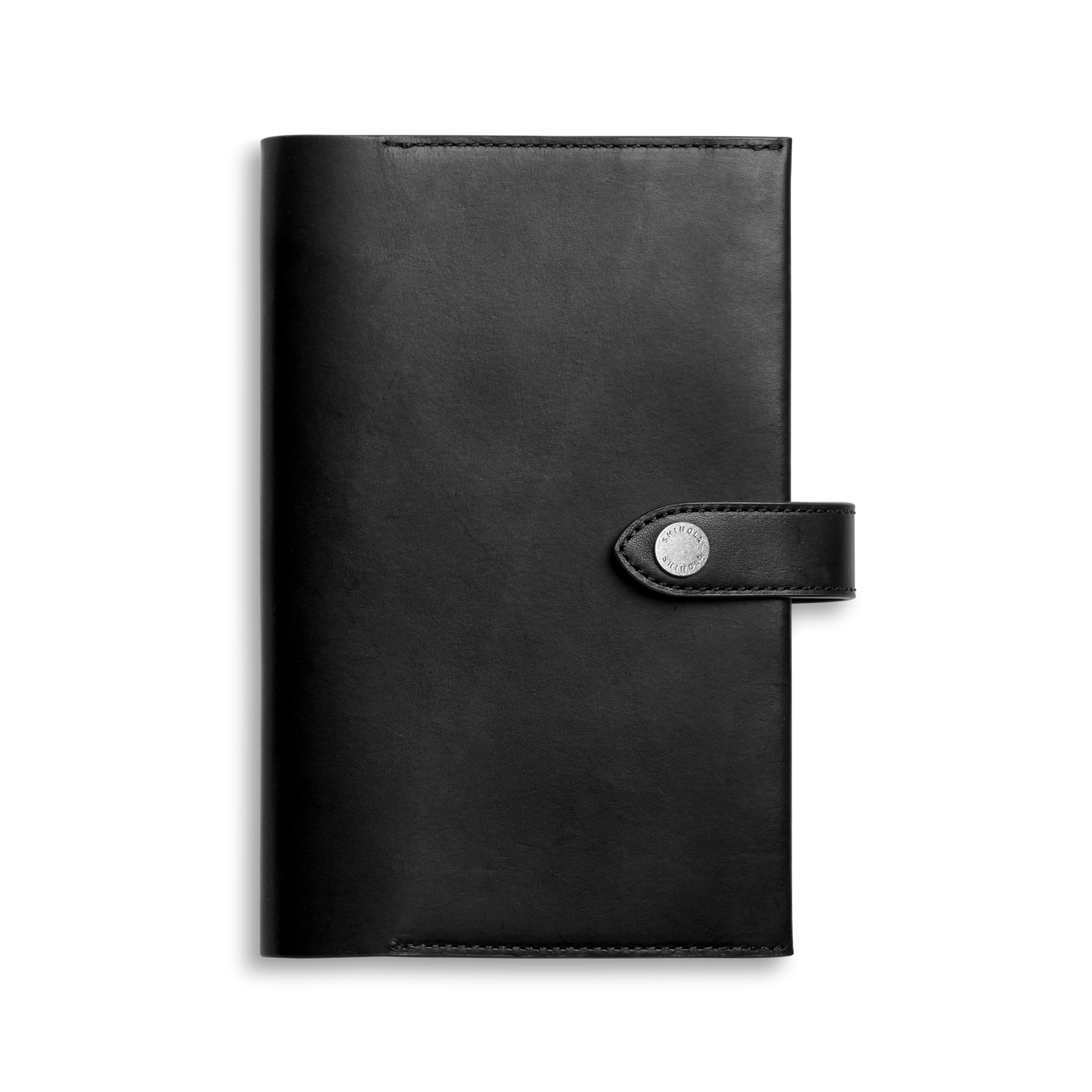 The Shinola Medium Snap Journal Cover in black Vachetta features visible edge stitching and a sleek, sophisticated design, with a flap closure secured by a snap button for a polished and luxurious Italian leather look.