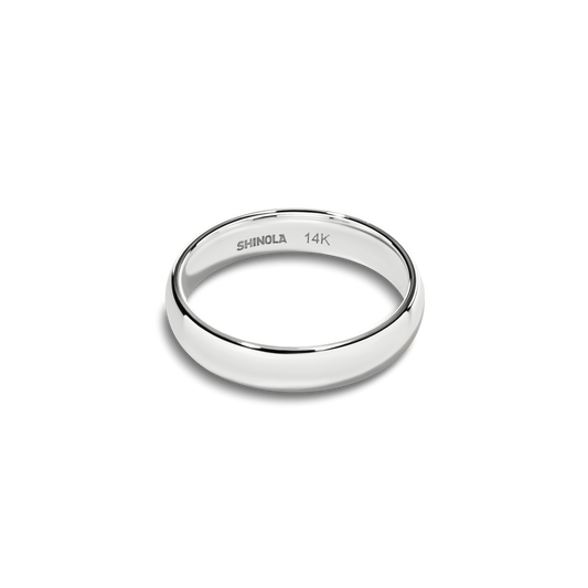 The Shinola 4mm Round White Gold Band is a polished, engraved ring featuring "SHINOLA 14K" inside. Displayed on a light gray background, this timeless accessory is crafted in classic 14K white gold with a smooth, rounded edge.