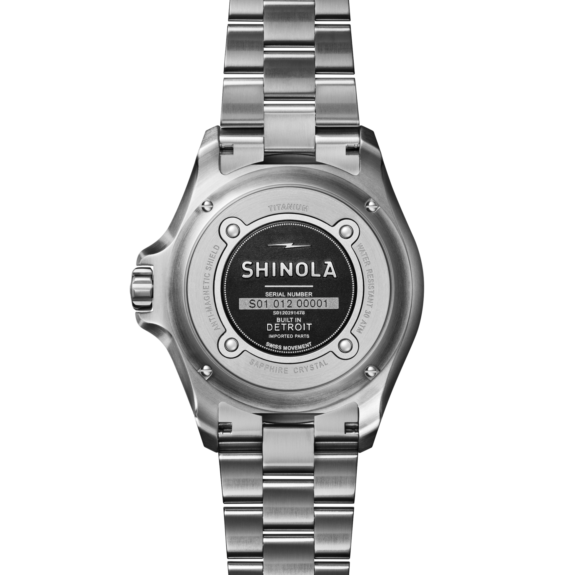 The back of a Shinola Lava Lake Monster Automatic Watch - Cardinal showcases engraved details like the brand name, serial number, “Built in Detroit,” and highlights such as titanium construction, sapphire crystal, and Argonite movement.