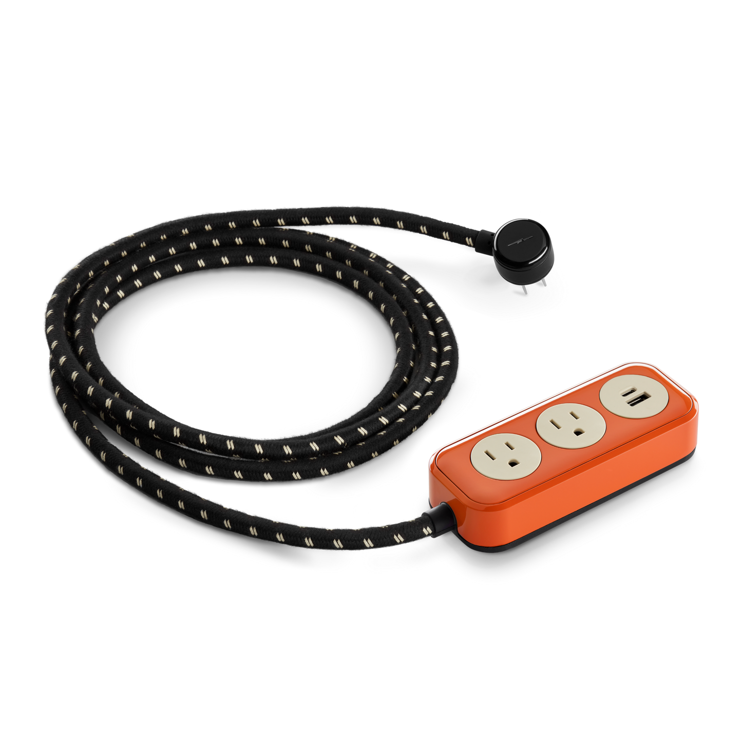 The Shinola 2 Port Power Supply - Tangerine is a power strip with an orange rectangular base, two standard outlets, USB-A and USB-C quick-charging ports, and a long braided cord with a round black plug.