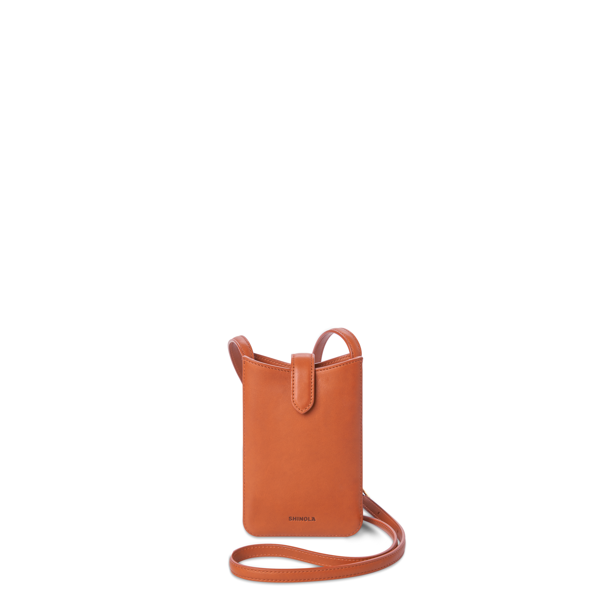The Bixby Phone Crossbody - Rust by Shinola is a compact, rectangular bag in natural leather with a long strap and flap tab, featuring the Shinola logo embossed near the bottom.