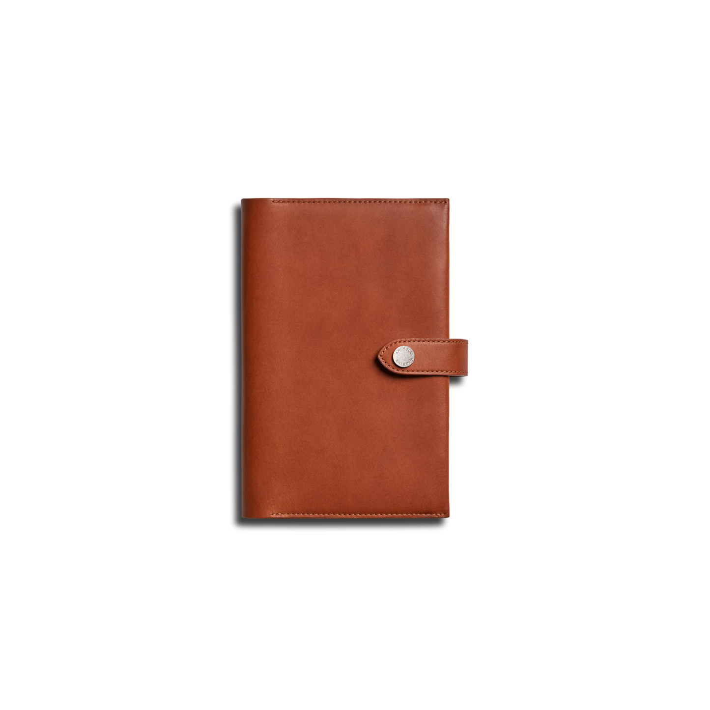 The Shinola Medium Snap Journal Cover in Rust is shown closed, featuring a strap and snap button closure, photographed against a plain white background.
