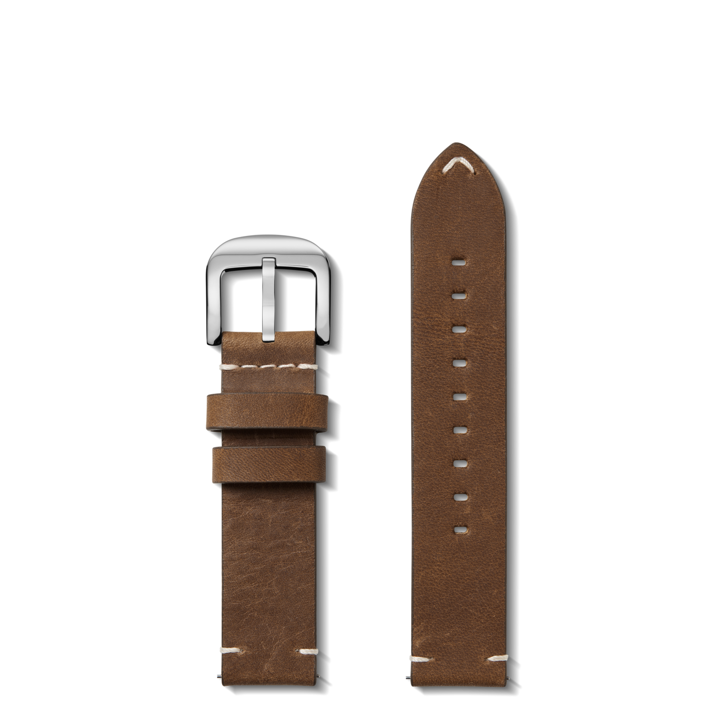 The Shinola 20mm British Tan Leather Watch Strap is displayed in two pieces on a white background: one with a silver buckle, the other with size adjustment holes and accented by white, hand-sewn stitching.