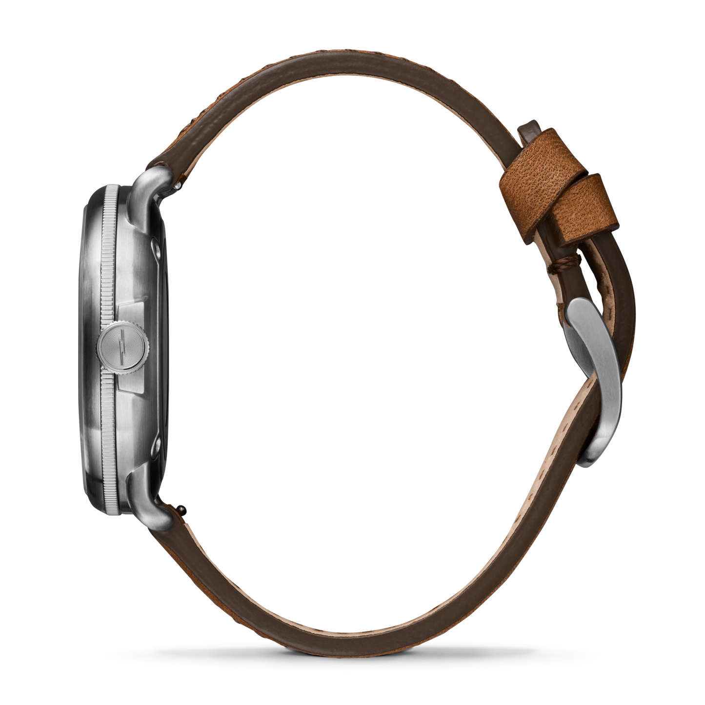 Side view of the Shinola Canfield C56 Watch - Continental Blue with a round silver case and brown leather strap, showing the buckle and stitched details. The watch face is not visible.