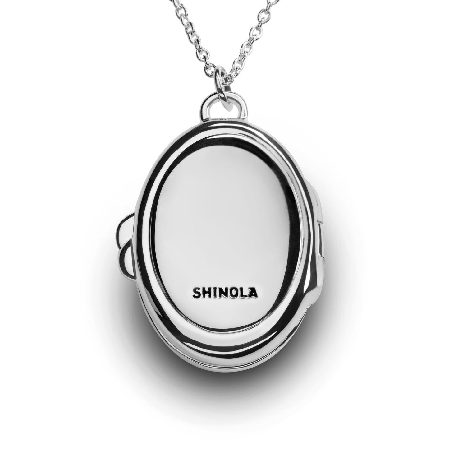 The Heirloom Petite Locket Necklace by Shinola features a sterling silver locket engraved with "SHINOLA" on the front, displayed on a chain and photographed against a white background.