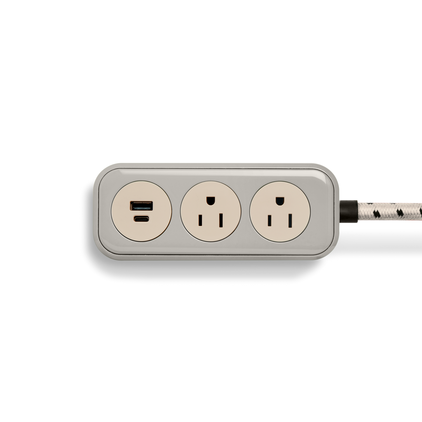 The Shinola 2 Port Power Supply - Stone features two three-prong outlets, one USB port, and a black and white braided extension cord, displayed on a white background.