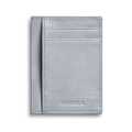 The Canfield ID Card Holder in Mist by Shinola is a slim wallet crafted from light gray pebbled leather, featuring visible stitching, two card slots, and the Shinola logo embossed at the bottom front.