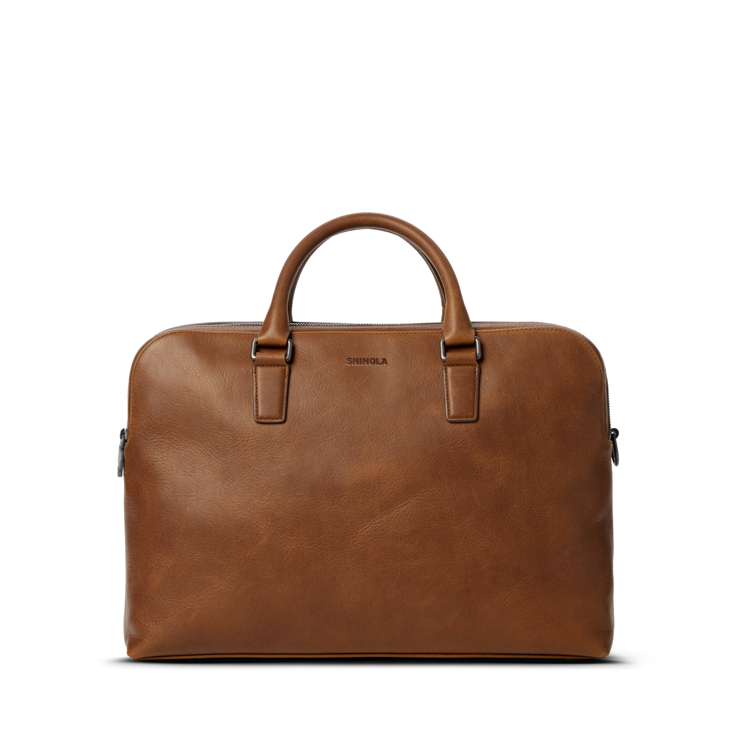 The Shinola Double Zip Briefcase in medium brown features premium leather, two handles, a smooth finish, and the Shinola logo embossed near the top center, displayed against a plain white background.