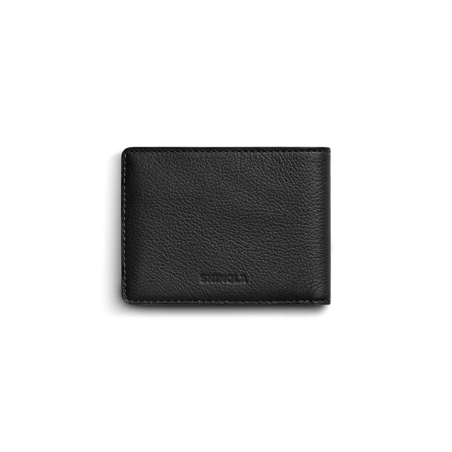 The Shinola Canfield ID Bifold Wallet in black features pebbled leather with a subtle texture and visible stitching, shown closed against a plain white background.