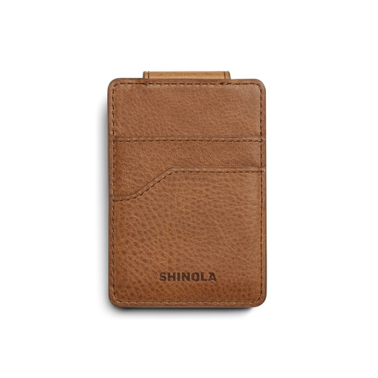 The Magnetic Money Clip Card Holder - Tan by Shinola features two credit card slots, a textured leather finish, and an embossed brand name. Shown on white background; monogramming available for personalization.