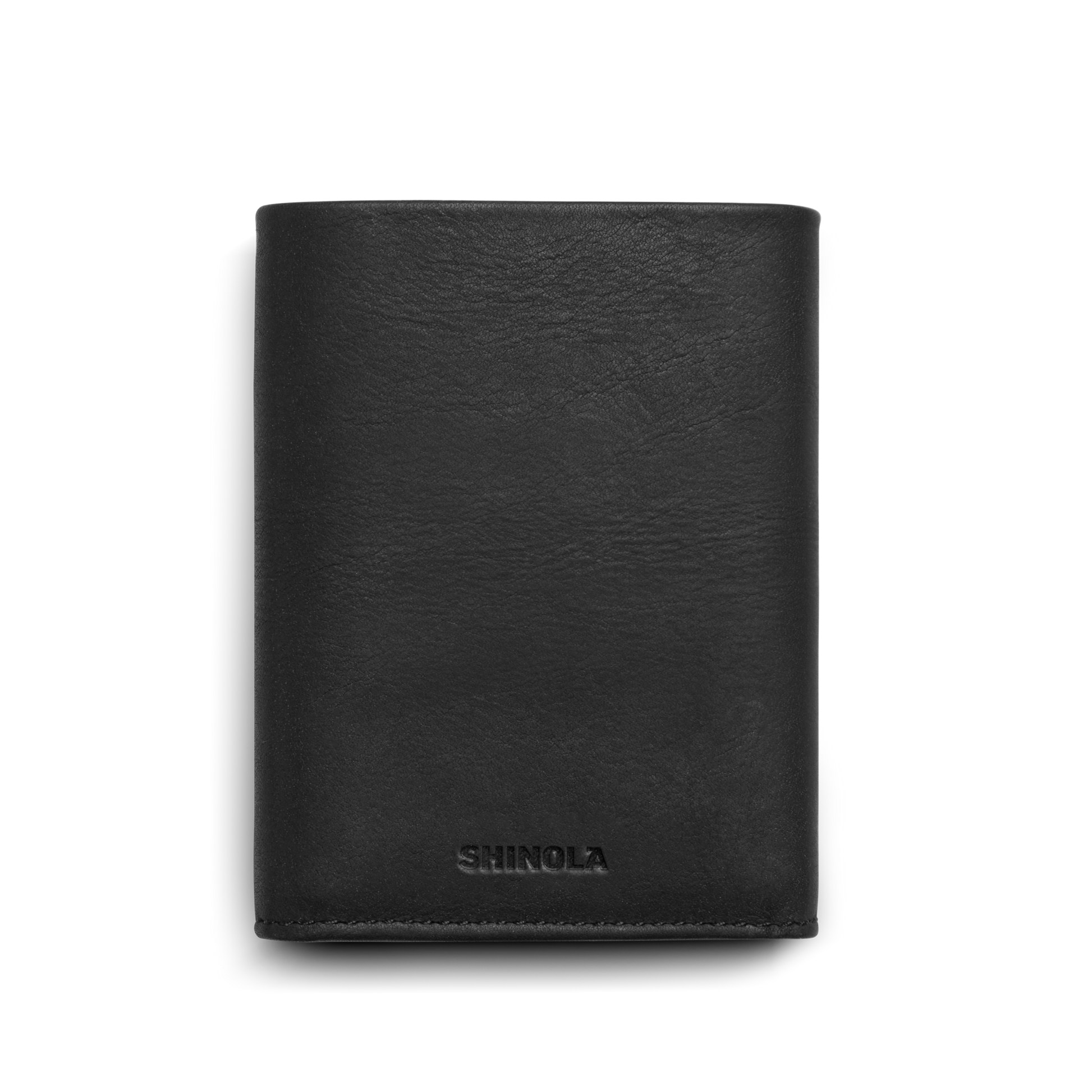 A closed, black Trifold Wallet - Dominos by Shinola, with SHINOLA embossed near the bottom and RFID protection, is photographed against a plain white background.