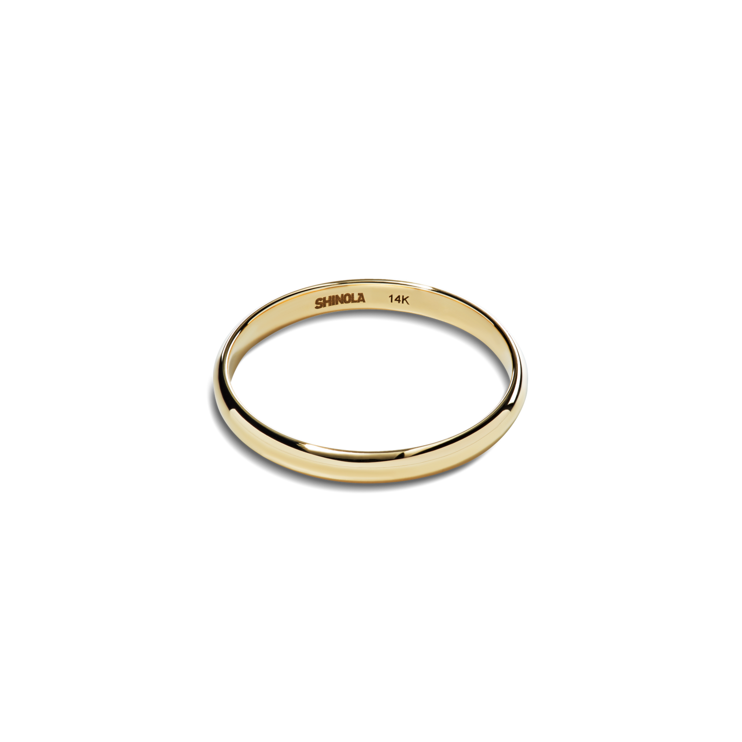 The Shinola 2mm Round Yellow Gold Band, engraved with SHINOLA 14K inside, is a simple and elegant 14k yellow gold ring shown on a plain white background.