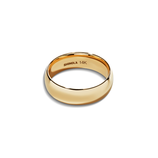 The Shinola 6mm Round Yellow Gold Band is a polished, plain 14k yellow gold ring with "SHINOLA 14K" engraved inside, shown on a white background—an elegant, timeless piece of personalized jewelry.