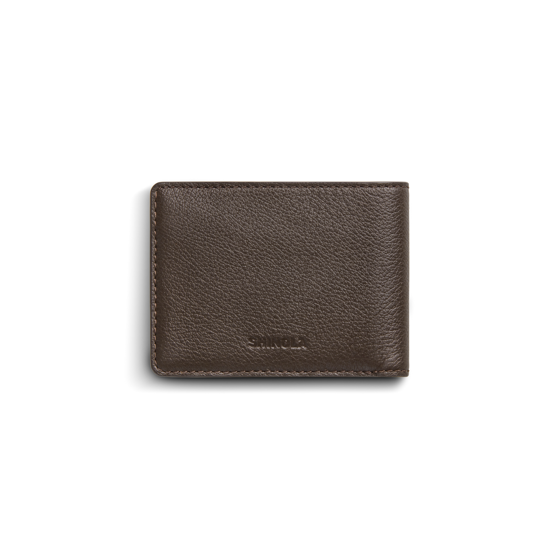 The Shinola Canfield ID Bifold Wallet in Espresso features brown pebbled leather with visible edge stitching and a subtle Shinola logo embossed on the lower front, shown closed against a white background.