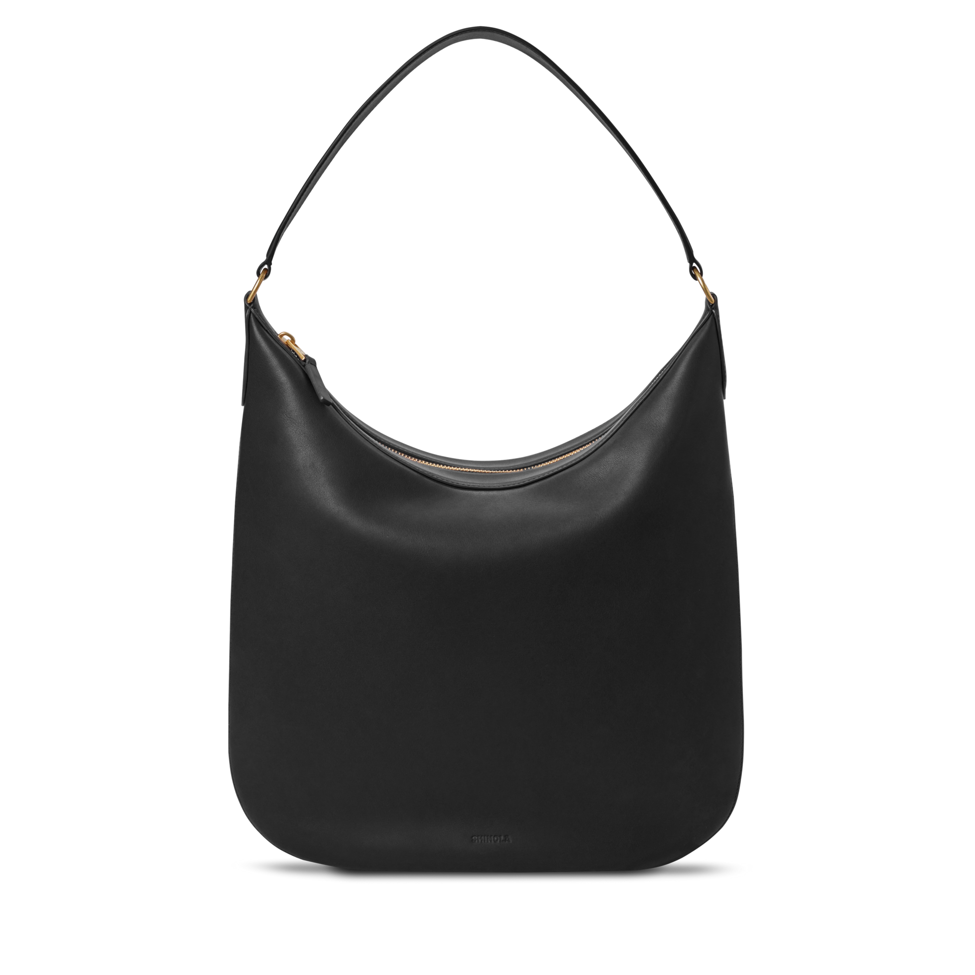 The Shinola Bixby Shoulder Bag - Black is a sleek leather hobo handbag with a minimalist design, gold-tone hardware, and a single curved strap, shown against a plain white background.