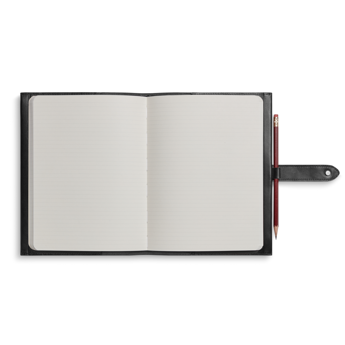 The Shinola Large Journal Cover in black leather holds an open, lined notebook, shown from above. A red pencil is secured in a loop on the cover’s right side against a white background.