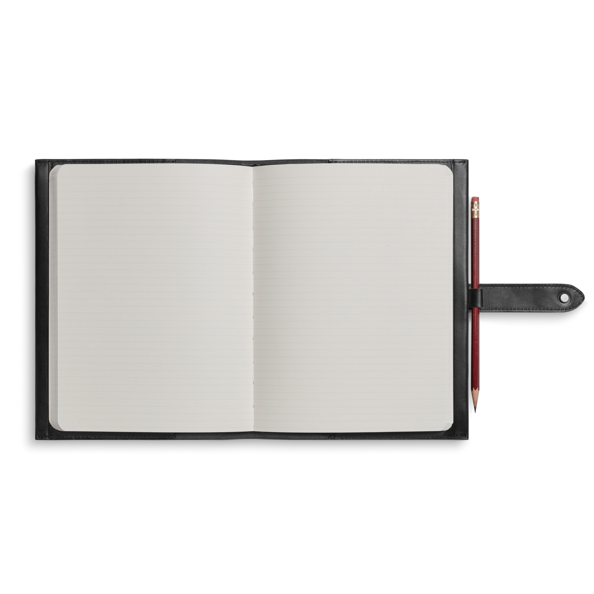 The Shinola Large Journal Cover in black leather holds an open, lined notebook, shown from above. A red pencil is secured in a loop on the cover’s right side against a white background.