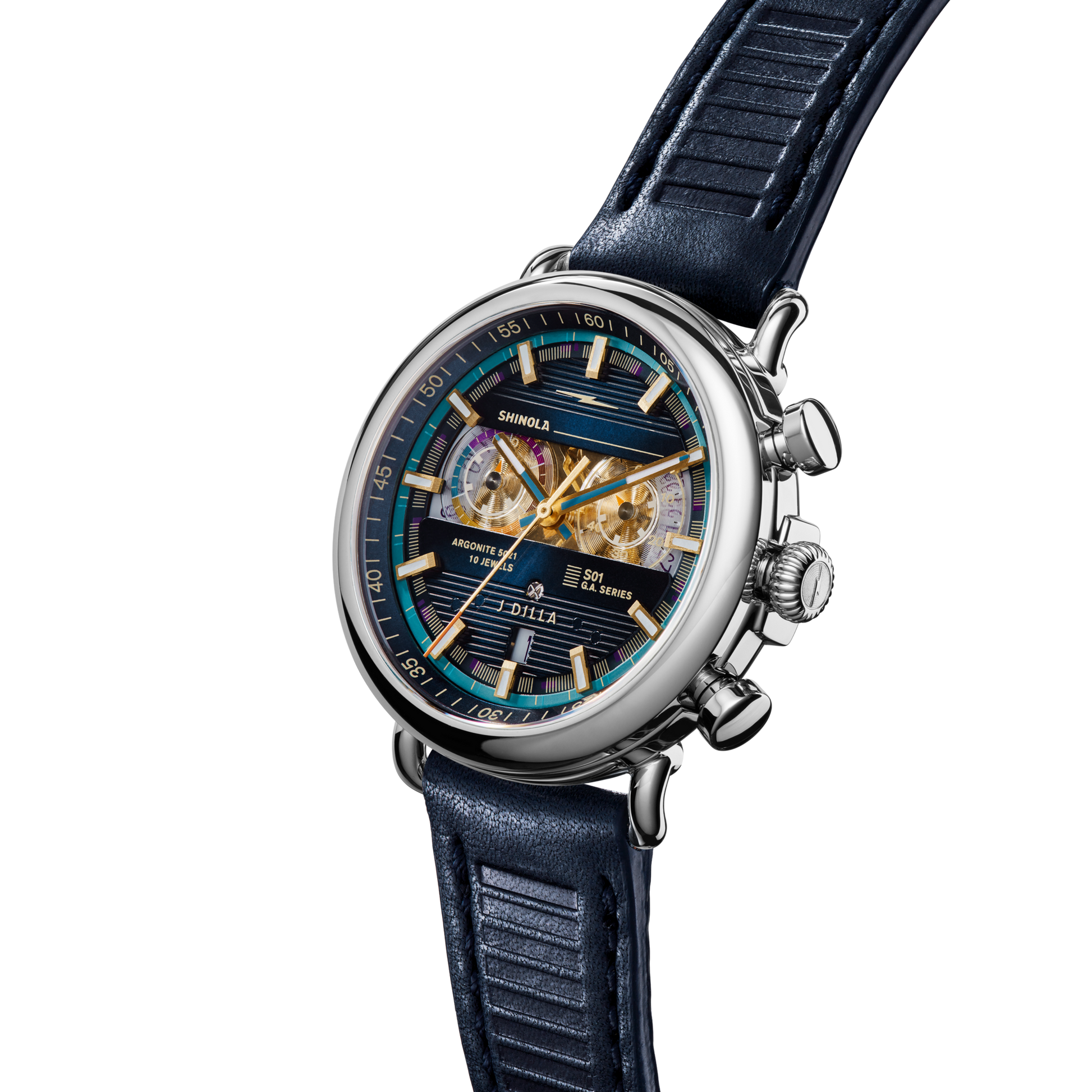 The Shinola J Dilla Runwell Chronograph Watch - Midnight Blue features a blue leather strap, silver case, and a detailed multicolored dial with gold-tone hour markers, hands, and multiple subdials set against a white background.
