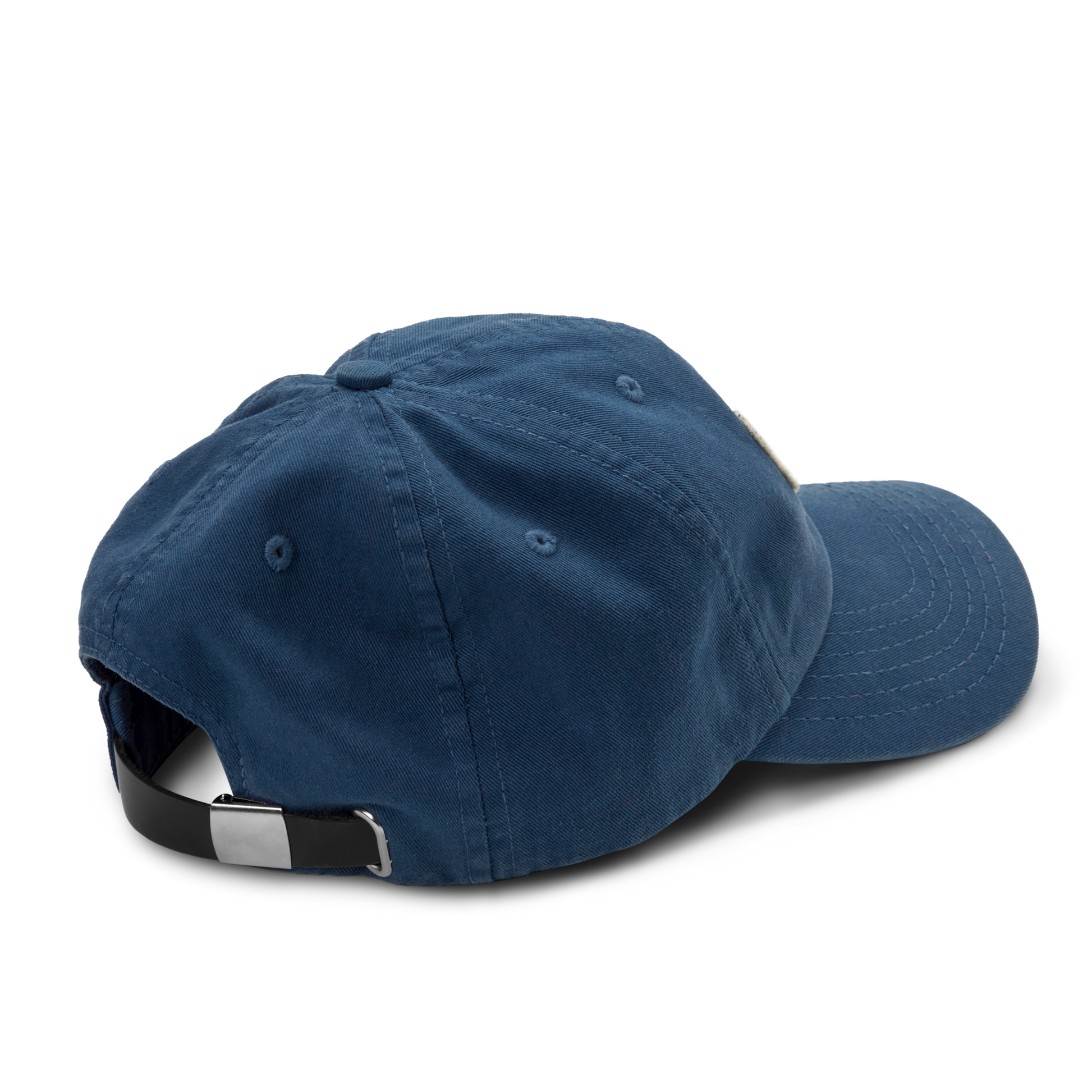 The Shinola Cotton Twill 6 Panel Cap is showcased in blue, with garment-dyed cotton twill and an adjustable black leather strap with a silver clasp, displayed from the back on a plain white background.