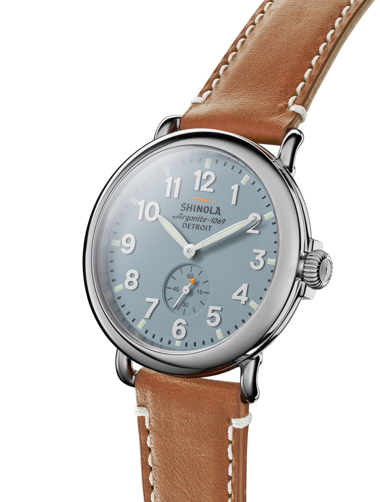 The Shinola Runwell Watch in Gray/Blue features a slate blue dial with white numerals and a brown leather strap with white stitching, displayed at an angle on a white background.