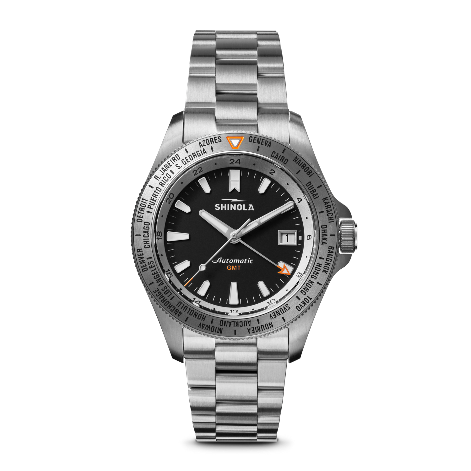The Shinola Monster Worldtimer GMT Watch features a black dial, silver hour markers, date window at 3 o’clock, world timer bezel with cities, orange GMT hand, and a metal link band—perfect for travelers.