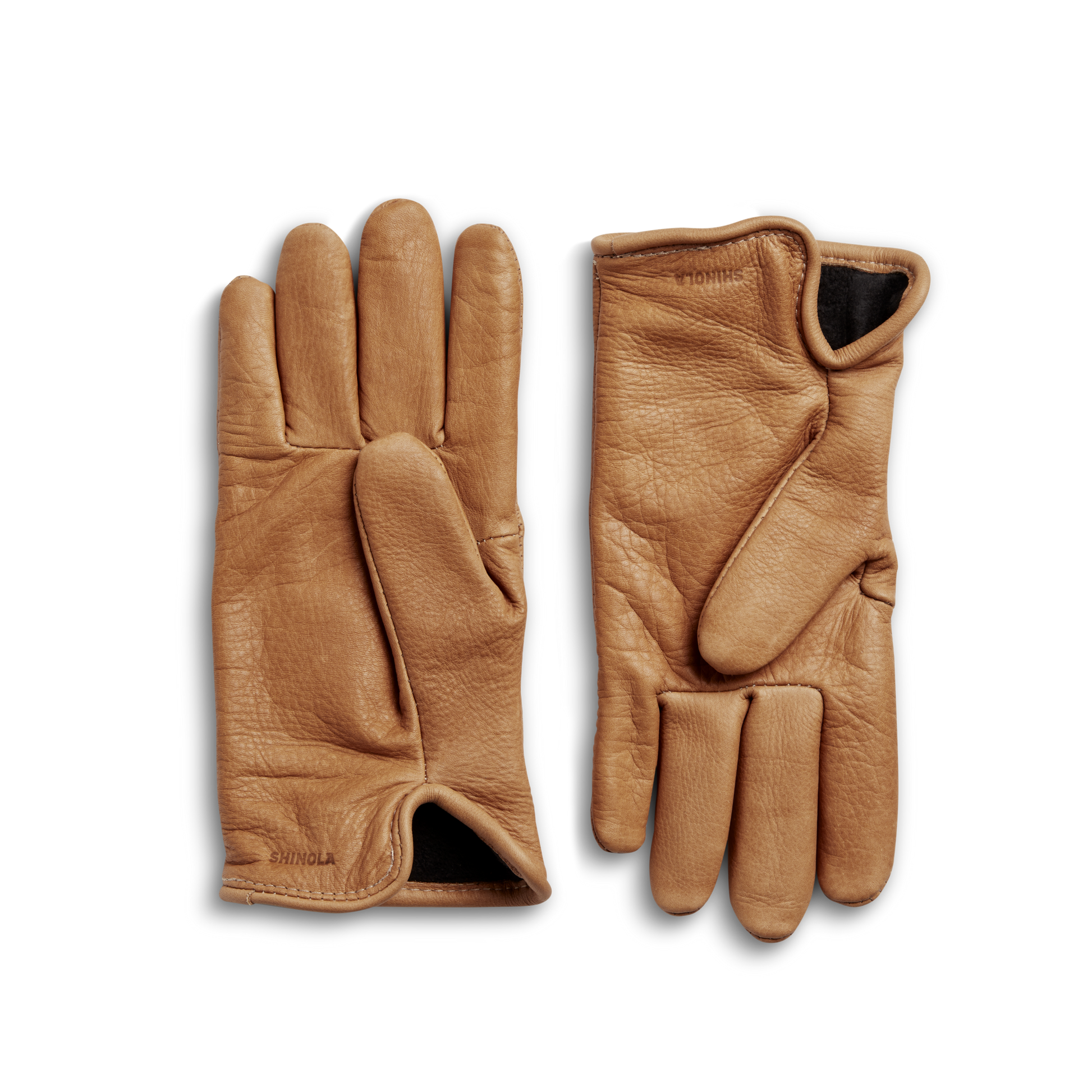 A pair of Shinola Lined Leather Gloves - Tan is shown laid flat on a light background, with one glove displaying the palm and the other displaying the back.