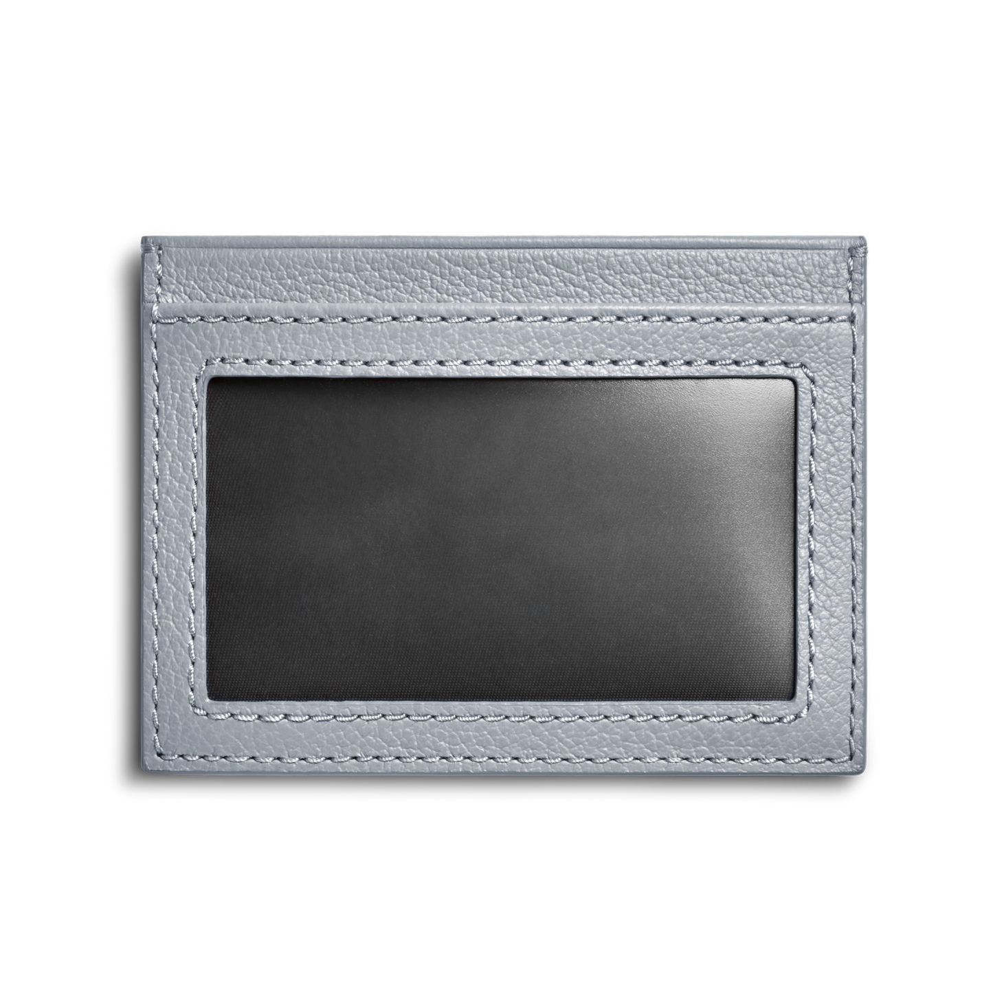 The Shinola Canfield ID Card Holder in Mist is a light gray pebbled leather wallet featuring a clear window for displaying an ID or card, shown against a plain white background.