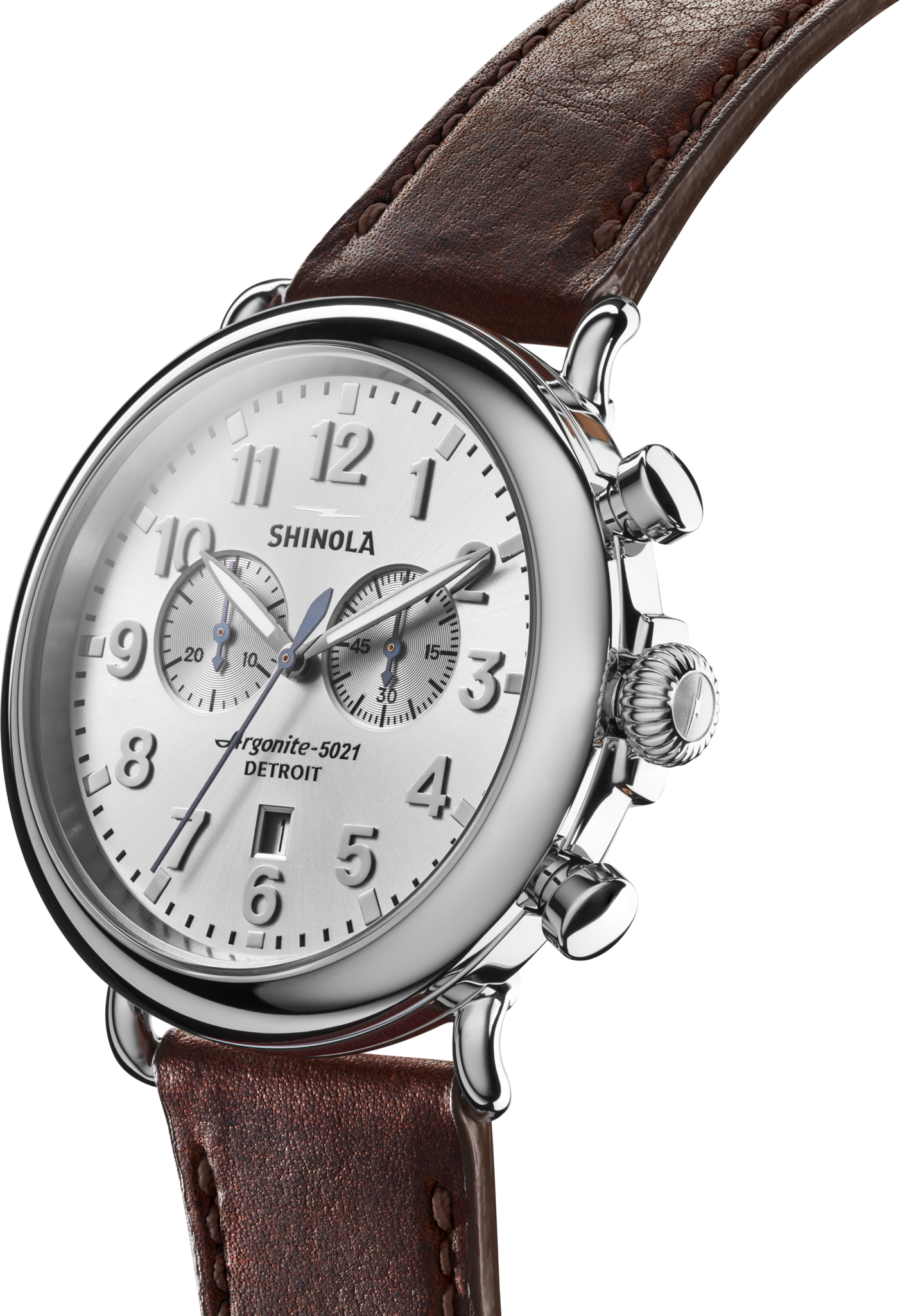 Close-up of the Shinola Runwell Chronograph Watch - Silver, featuring a stainless steel case, white dial with silver numerals and hands, three subdials, and a brown leather strap.