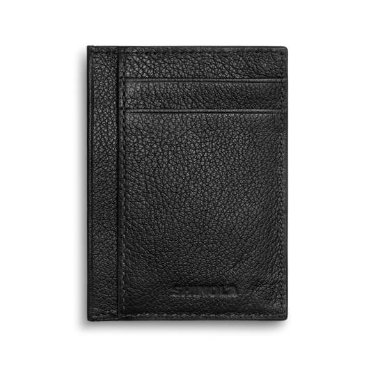 The Canfield ID Card Holder by Shinola is crafted in black pebbled leather and features two card slots plus a center pocket. The Shinola logo is embossed at the bottom. Slim and stylish, it’s photographed against a white background.