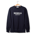 The Shinola Logo Sweatshirt - Navy by Shinola is a unisex French Terry sweatshirt in navy, featuring bold white "SHINOLA DETROIT" lettering on the front.