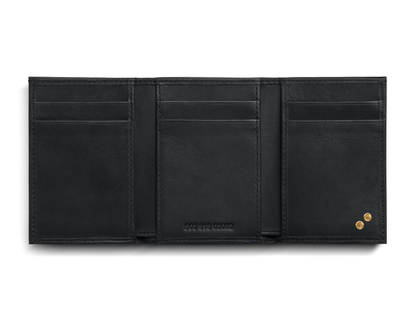 The Shinola Trifold Wallet - Dominos in black leather is open, displaying three card slots per side, a stamped serial number at the center, RFID protection, and two gold-tone rivets on the right interior.