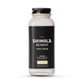 A clear glass jar of Shinola Shoe Cream - Neutral with a black lid and label featuring white and gold text, warning it is harmful if swallowed.
