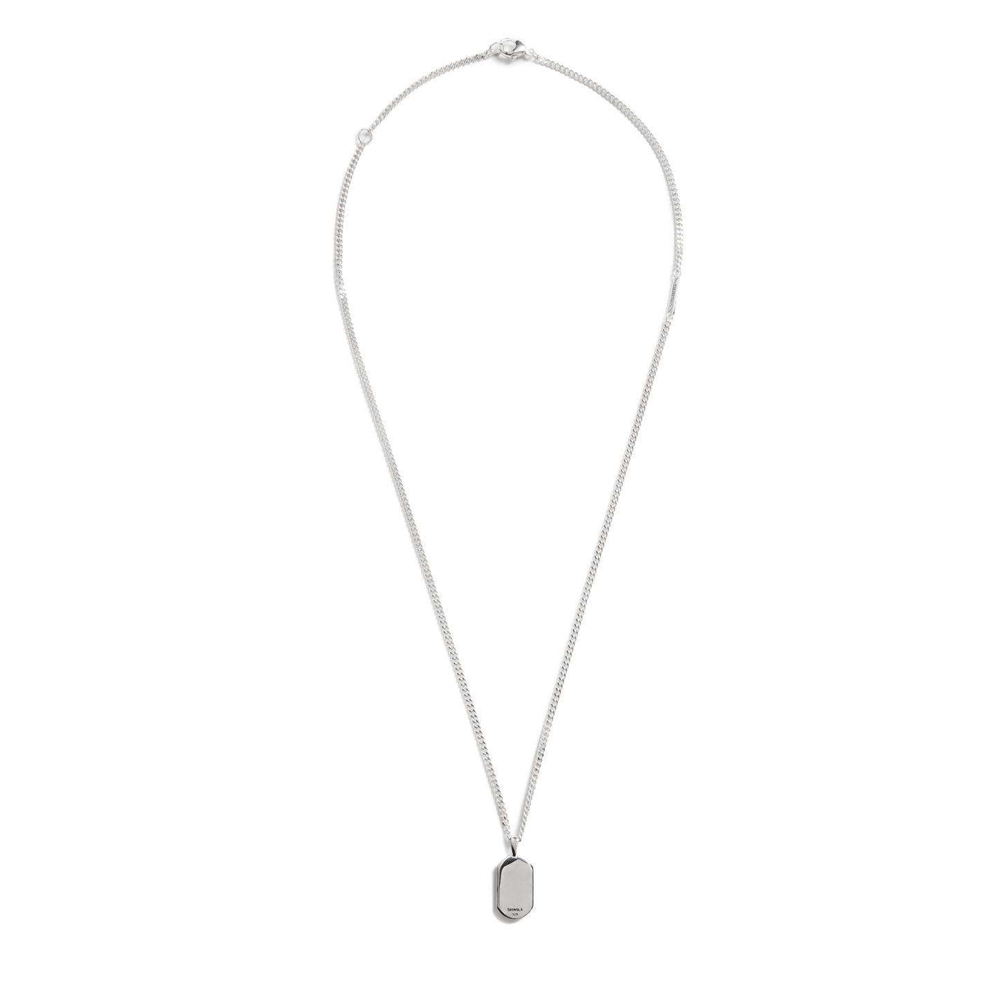 The Shinola Turquoise Inlay Tag Necklace features a thin sterling silver chain and a small rectangular pendant with turquoise inlay, displayed on a plain white background.