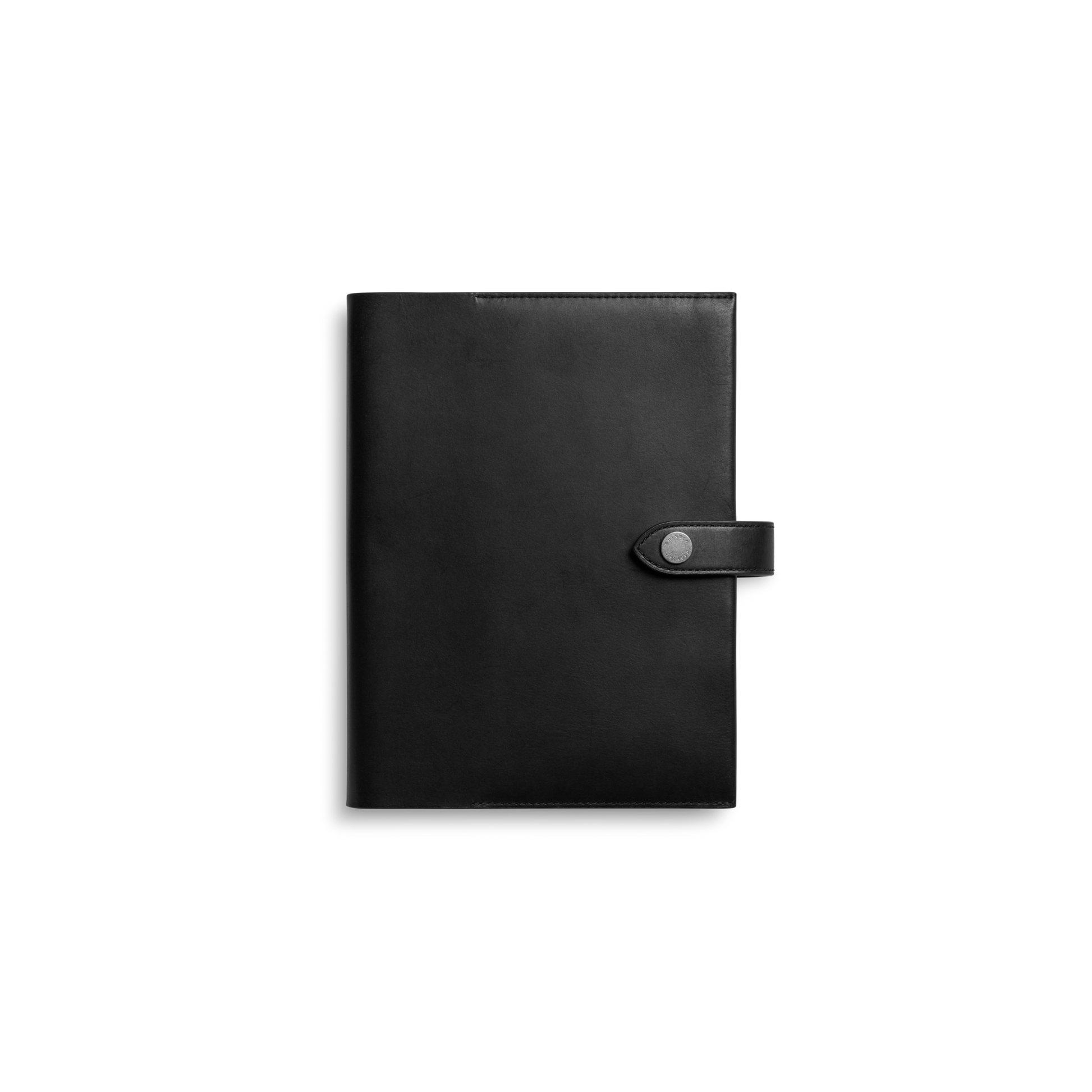 The Shinola Large Journal Cover in black features closed Italian Vachetta leather with a snap button strap closure, displayed against a plain white background.