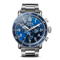 The Shinola Runwell Sport Chronograph Watch - Midnight Blue features a stainless steel case and bracelet, blue dial with white numerals, three subdials, and two side pushers, shown against a white background.