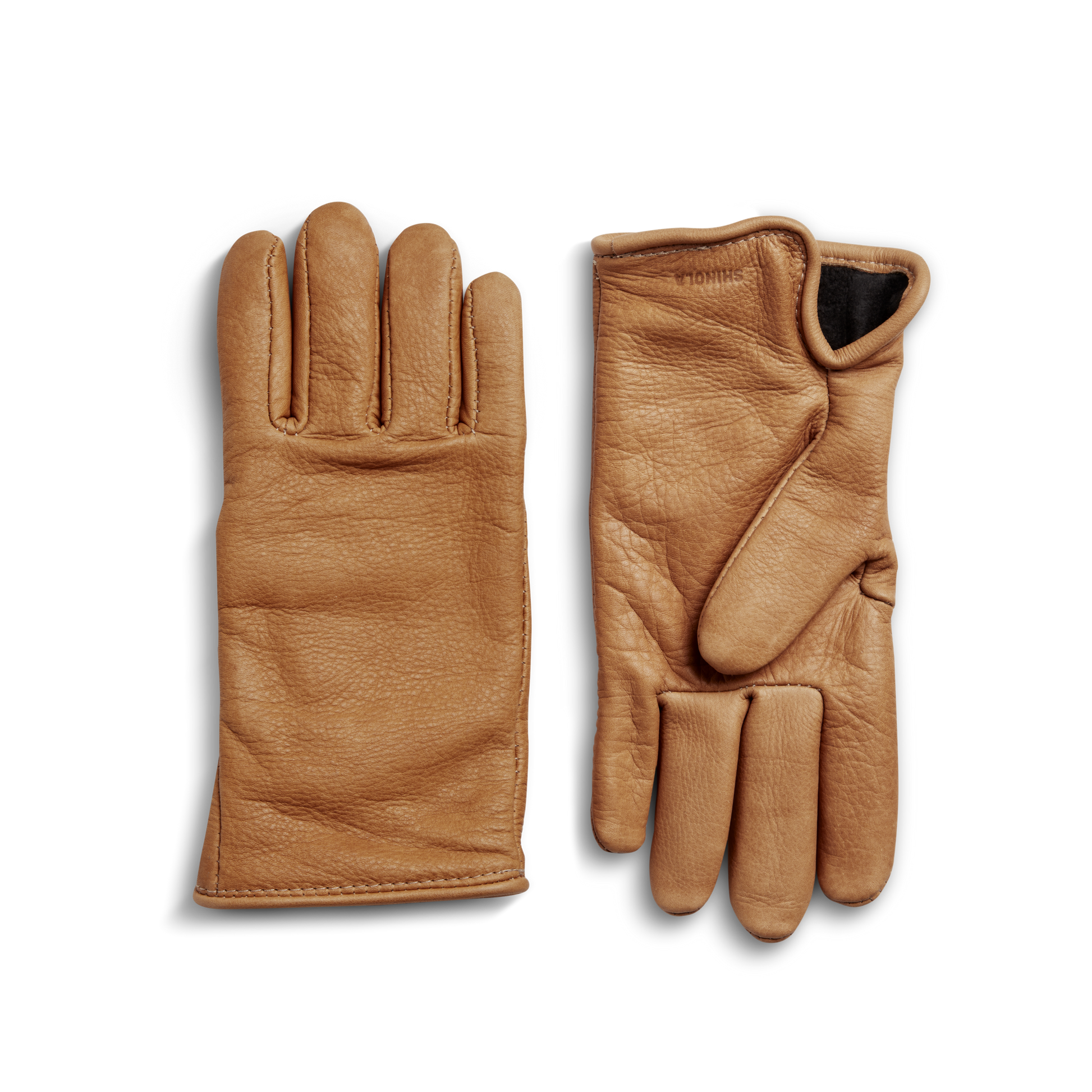 A pair of Shinola Lined Leather Gloves in tan bovine leather, one palm up and one palm down, displayed on a white background; quality gloves sewn in the USA.