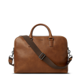 Shinola Double Zip Briefcase in medium brown leather with top handles and a dark brown adjustable, detachable shoulder strap, shown on a plain white background.