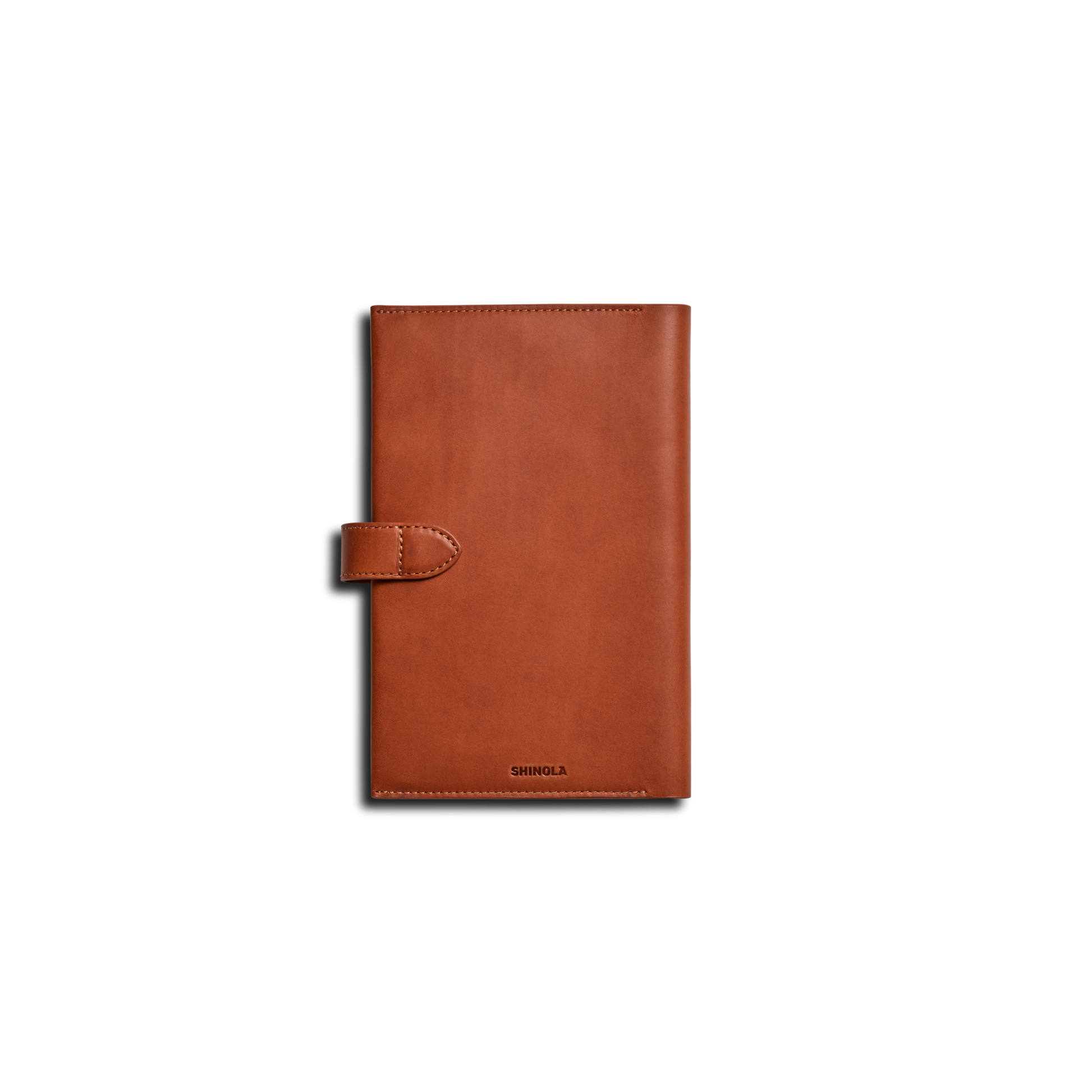 The Shinola Medium Snap Journal Cover in rust Italian leather features a snap closure and is shown vertically on a plain white background, with the brand name embossed near the bottom edge.