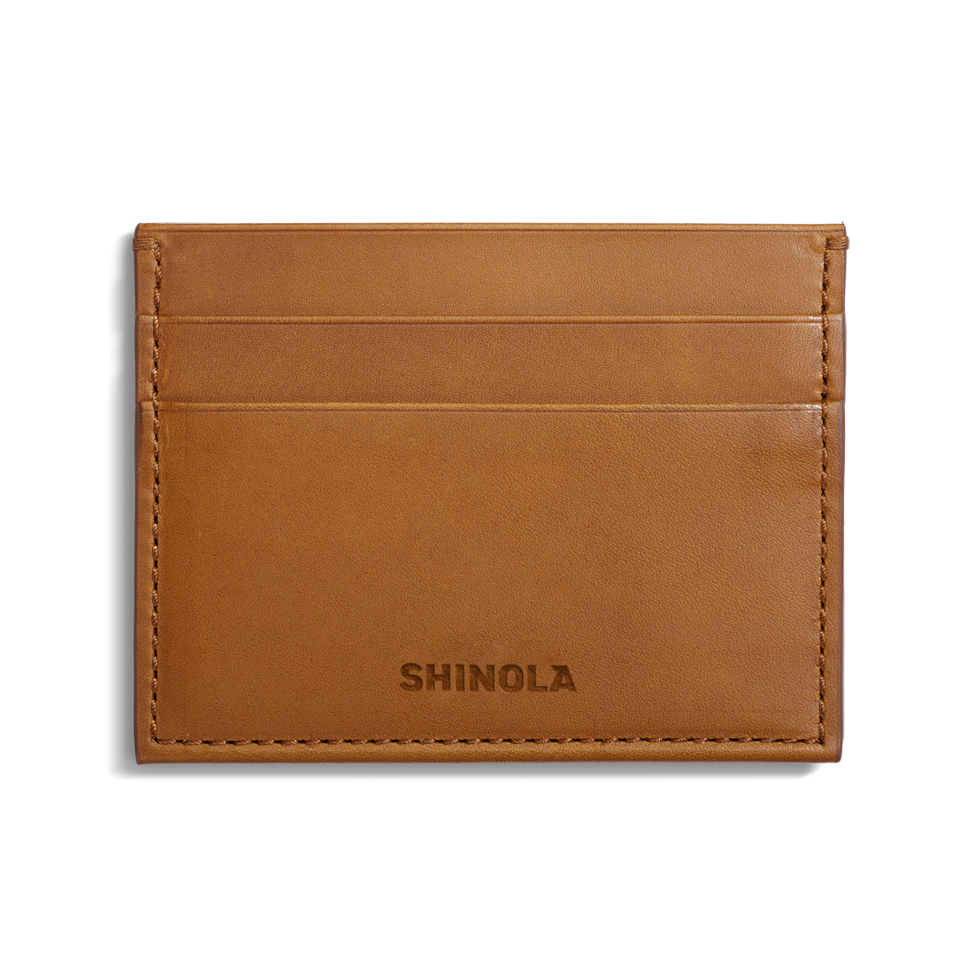 The Shinola 5 Pocket Card Holder in tan vachetta leather features two card slots, clean edge stitching, and SHINOLA embossed at the bottom center. It is shown against a white background.