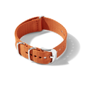 The Shinola 22mm Orange G10 Nylon Watch Strap features a silver buckle and loops, shown in a circle on a white background with soft shadow; compatible replacement band for the Shinola Monster Automatic.
