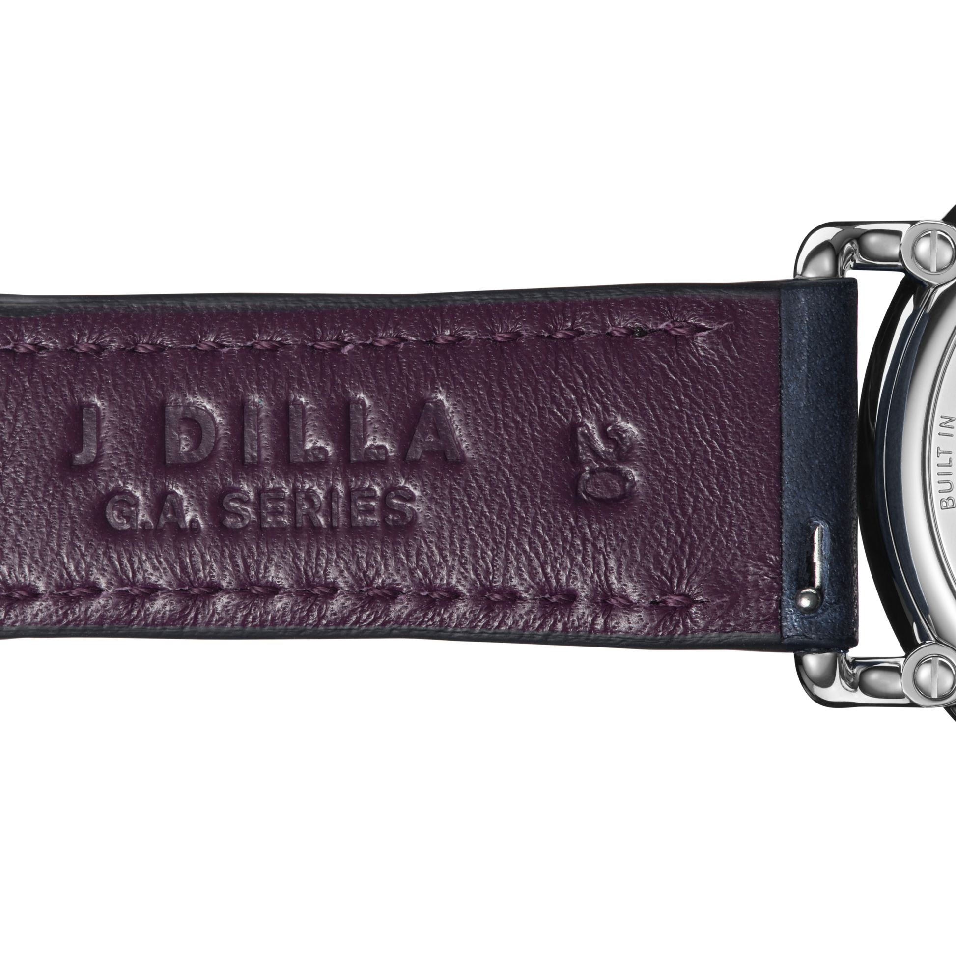 Close-up of a dark purple leather strap embossed with J DILLA GA SERIES and logo, attached to the silver Shinola J Dilla Runwell Chronograph Watch - Midnight Blue.