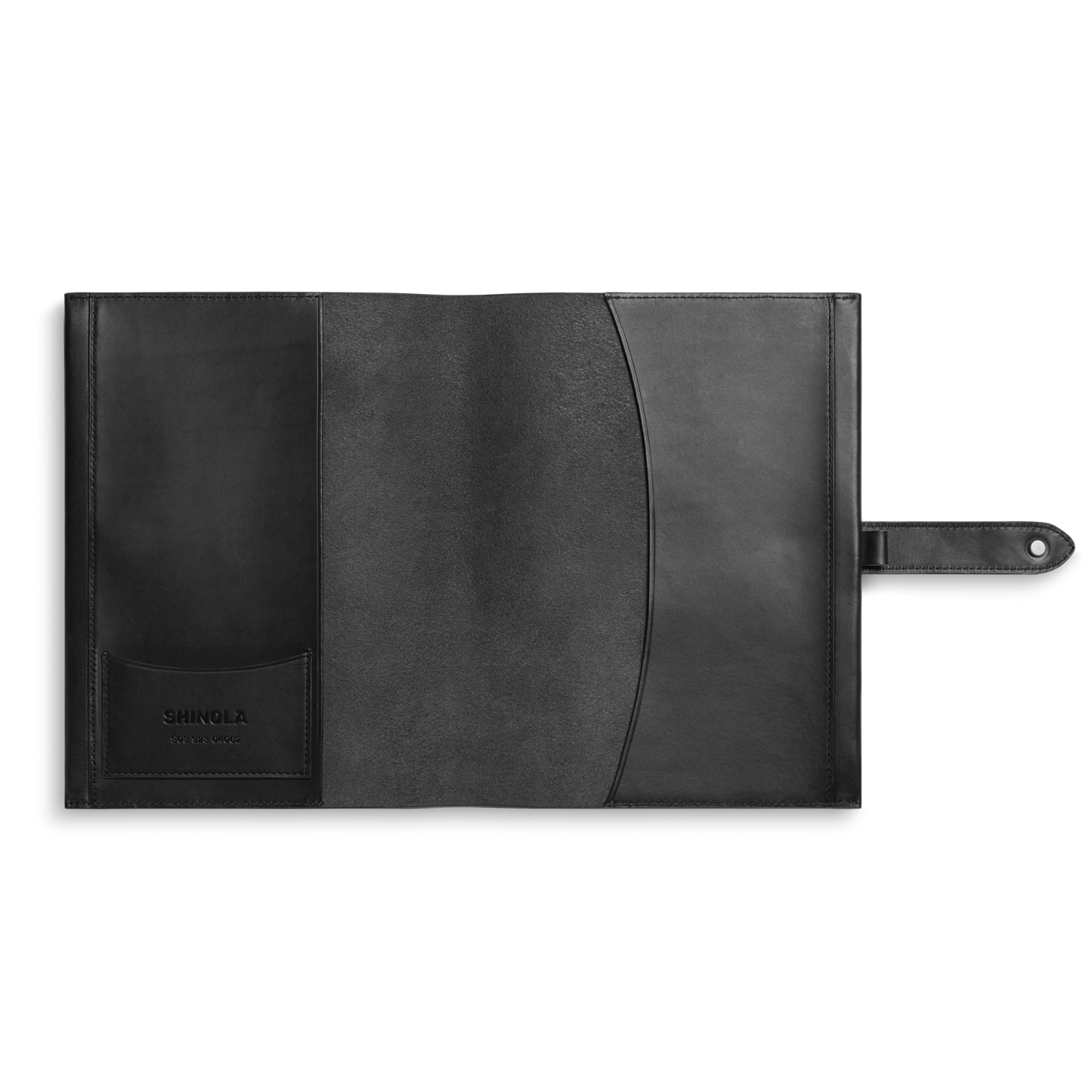 The Shinola Large Journal Cover in black Italian Vachetta leather features interior pockets (one with the Shinola logo) and a right-side tab closure. This sleek, minimal cover is perfect for organizing papers or notebooks.